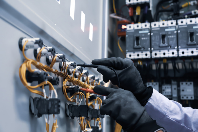 Business owner consulting electrician