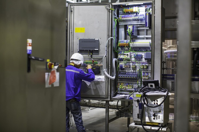 Commercial electrician reviewing building plans